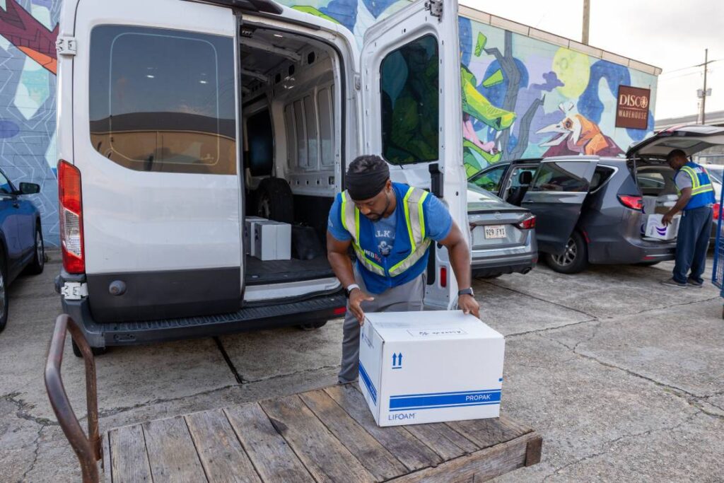 Driver for MedRx Logistics Team Loading the Last Box into the Van